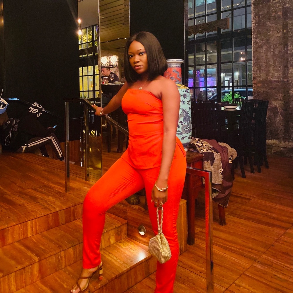 2 piece Orange boohoo pants and bandeau top set.